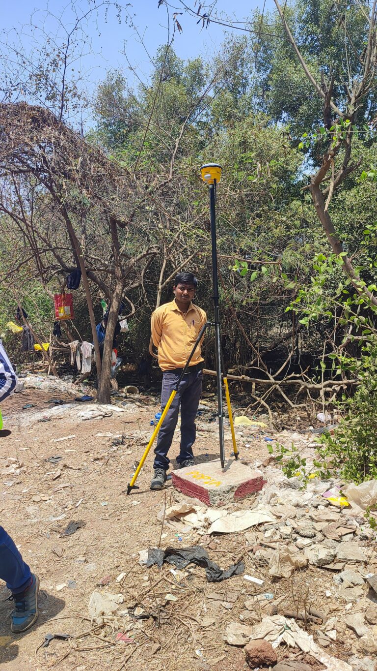 GNSS survey receiver mounted on tripod for land surveying