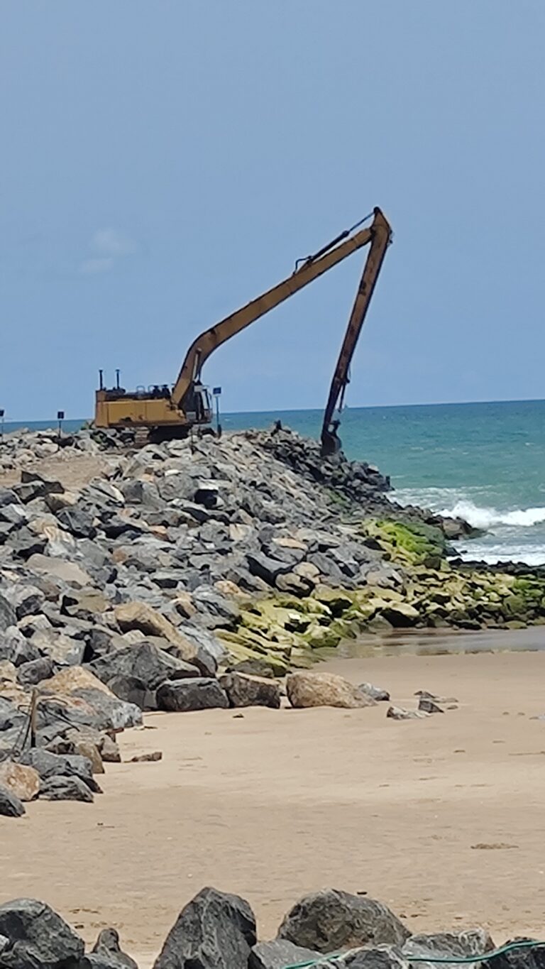 This image highlights marine construction work along a coastal area, featuring heavy equipment used for shoreline stabilization, breakwater development, and coastal infrastructure projects. Such activities support erosion control, port development, and long-term coastal resilience.